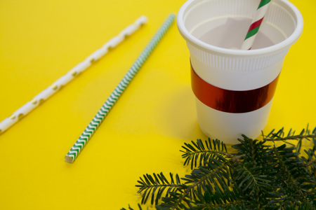 A christmas cup on a yellow backgroundの写真素材