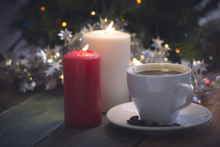 Still life with a coffee cup and candlesの写真素材