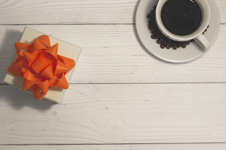A cup of coffee on a white wooden table