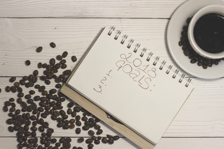 A notebook with 2018 goals inscription with a coffee cupの写真素材