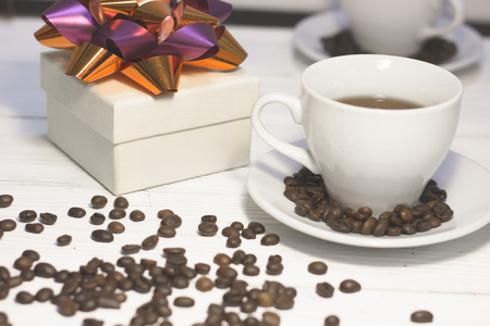 Cup of coffee and a gift boxの写真素材
