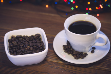 Still life with a coffee cup and a bowl of coffee beansの写真素材