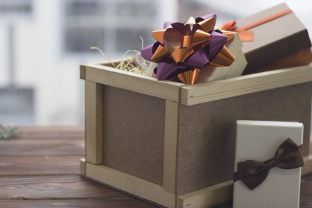 A festive still life with a big wooden box and a wreathの写真素材