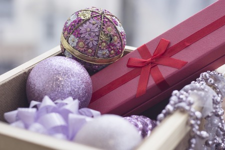 New year suprise in a box with a gift and ornamentsの写真素材