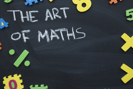 The art of maths inscribed with a chalk on a blackboard with a colorful number puzzle, educational concept. Space for your text or product displayの写真素材