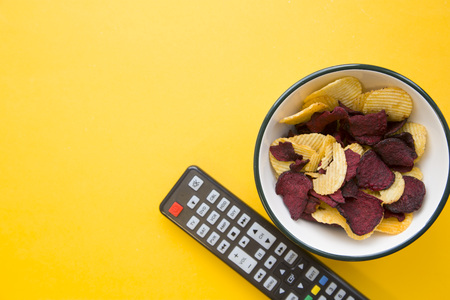Weekend, hobby and leisure concept. A one-color yellow background with bowl of potato and beetroot...