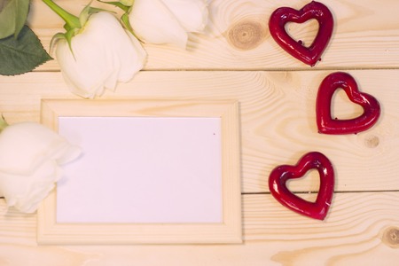 White roses on natural wooden backgroundの写真素材