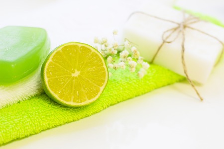 Spa, Aromatherapy, Natural Cosmetic concept. Set of bath essentials- clean towels, soap bars and...