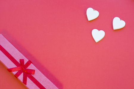 The concept of St.Valentine's Day with a gift box, red background top viewの写真素材