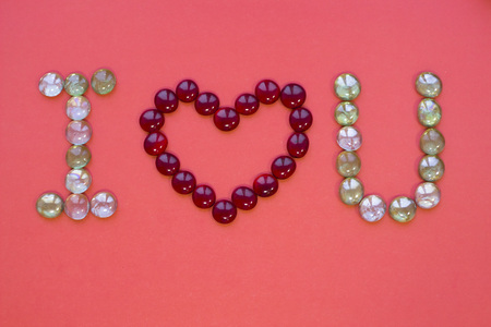 The concept of St.Valentine's Day with I Love You inscription, red background top viewの写真素材