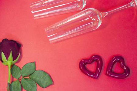 The concept of St.Valentine's Day red background with a beautiful and champagne glasses, top view, copy spaceの写真素材