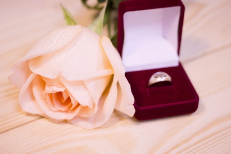 Concept of St.Valentine's Day, Love, Anniversary, Wedding with a beautiful cream rose and a wedding...