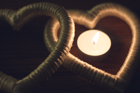 Candle in a heart frameの写真素材