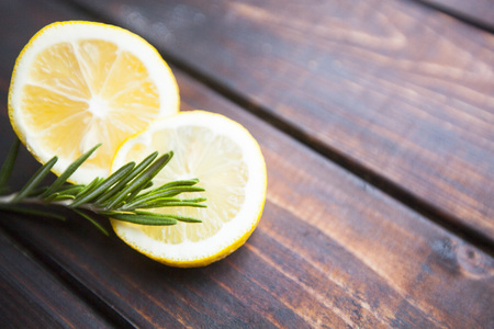 Fresh citrus on a dark wooden tableの写真素材
