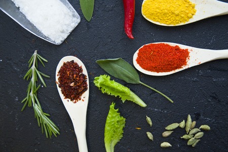 Set of specis and herbs on black backgroundの写真素材