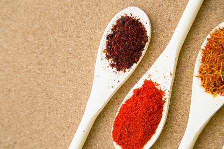 Set of spices and herbs on a corkwoodの写真素材