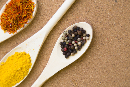 Set of spices and herbs on a corkwood