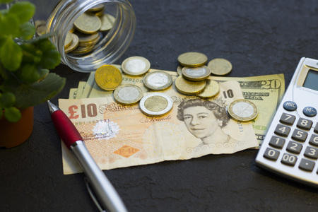 Coins stacked on each other in different positionsの写真素材