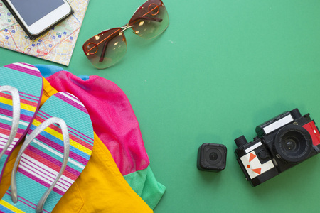 Tourist items on green one-colour background
