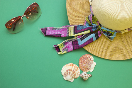 Seaside holiday accessories on a green wooden background.の写真素材