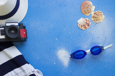 Blue background with travel itemsの写真素材