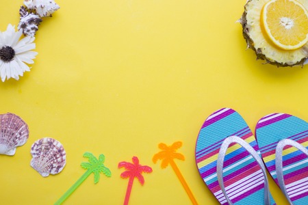 Yellow background with travelling itemsの写真素材