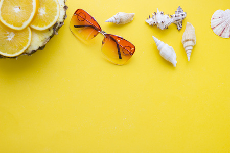 Yellow background with travelling itemsの写真素材