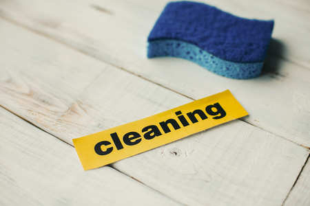 Cleanup in a kitchen. A bright abstract composition with scrub dishwashing sponges on a white wooden background. Close upの写真素材