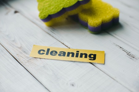 Cleanup in a kitchen. A bright abstract composition with scrub dishwashing sponges on a white wooden background. Close upの写真素材