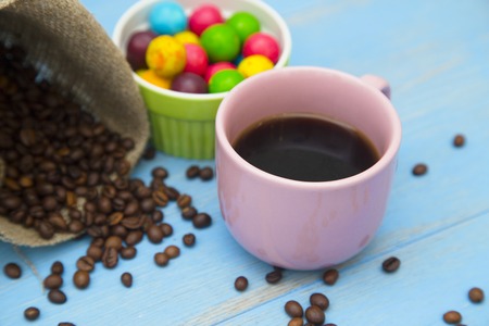 Coffee with sweets on a blue wooden backgroundの写真素材