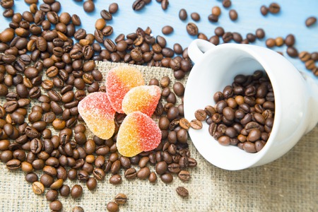 Coffee with sweets on a blue wooden backgroundの写真素材
