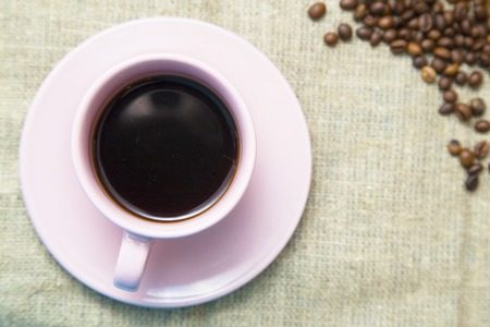 Coffee with sweets on a blue wooden background