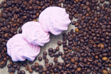 Love Coffee Concept. Murshmellows on coffee beans, close up, top viewの写真素材