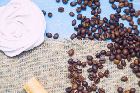 Coffee with sweets on a blue wooden backgroundの写真素材
