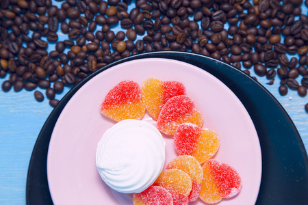 Coffee with sweets on a blue wooden backgroundの写真素材