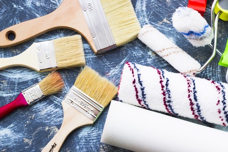 House renovation concept, paint cans and brushesの写真素材
