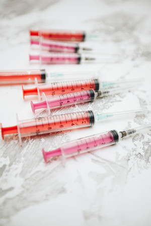 Pet medicine injection on white stone background top view copyspaceの写真素材