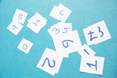 Numbers on wood board background. Take note of the product for book with paper and concept or copy space.の写真素材