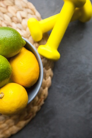 Healthy Breakfast, Sport, Fitness, Weight Loss, Diet Concept. A bowl of lemons and limes and...