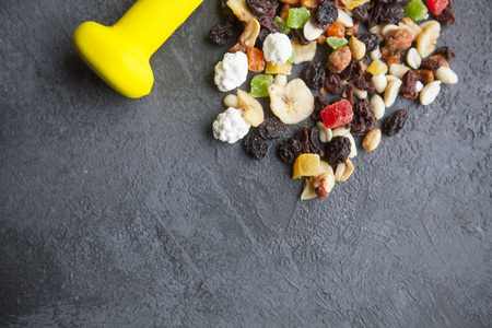 Healthy Breakfast, Sport, Fitness, Weight Loss, Diet Concept. A bunch of muesli with nuts and dry...