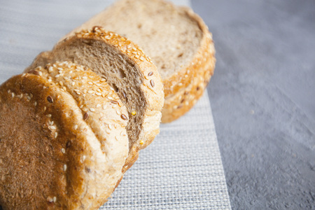 Healthy Breakfast, Sport, Fitness, Weight Loss, Diet Concept. Slices of wholegrain bread ,dark stone background, close upの写真素材