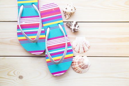 Preparing for vacation, travel or journey. Travel planning. Sleepers on white wooden background. ...