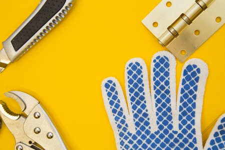 Repair and renovation concept. A set of metal tools for repair with drills, gloves, wrench and...