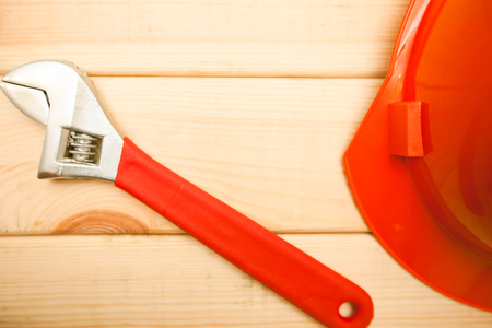 Repair carpenter tools: screwdrivers and helmet on white old wooden background, top view, copy spaceの写真素材