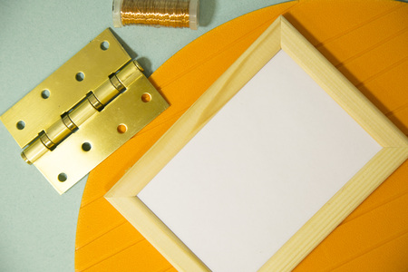 Repair modern tools around a frame board on blue and yellow background, top view, copy spaceの写真素材