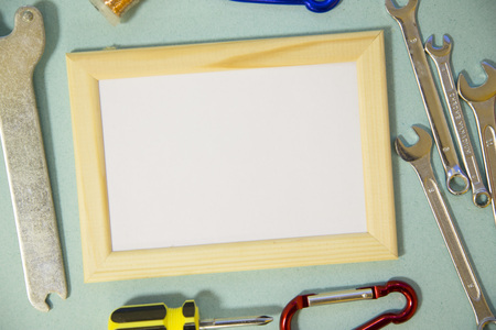 Repair modern tools around a frame board on blue background, top view, copy spaceの写真素材