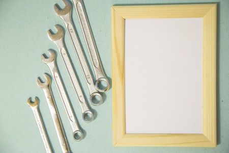 Repair modern tools around a frame board on blue background, top view, copy spaceの写真素材