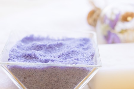 Spa and wellness setting with blue flowers, sea salt and soap on wooden white background closeupの写真素材