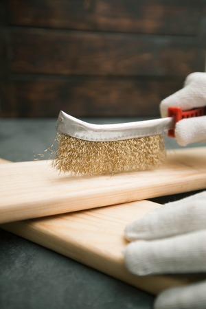 Repair modern tools: man hands in gloves on dark stone background, top view, copy spaceの写真素材