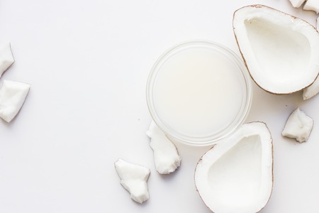 Top view peaces of coconut. Concept of the best all natural face moisturizer. Facial treatment...